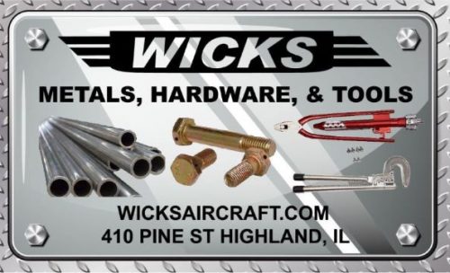 Metal sign featuring "Wicks" logo, with text "Metals, Hardware, & Tools." Includes images of metal pipes, bolts, and tools. Website and address: "wicksaircraft.com, 410 Pine St, Highland, IL." Background has a diamond plate pattern.