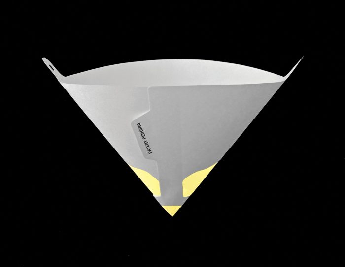 Fine Paint Strainer Cone shown against a black background. The cone is white with a yellow section at the bottom, designed for filtering paint. It features a cut-out tab for easy handling.