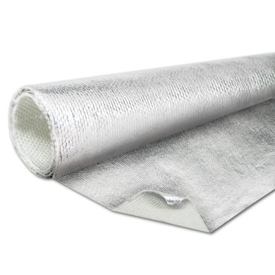 A rolled aluminized heat barrier material lies on a flat surface. The shiny, reflective surface is visible along with a textured underside, showcasing its insulation properties for heat resistance.