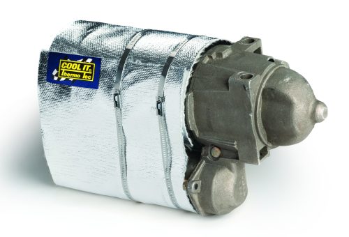 Starter Heat Shield designed to insulate a starter motor. The shield is silver, made of reflective material, and fits snugly around the motor, which is gray. A blue label with "COOL IT" is visible on the shield.