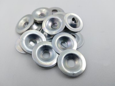 A pile of metal 601 Finishing Washers with an 82° angle, shown on a plain background. The washers have a smooth, shiny surface and a slightly concave shape.