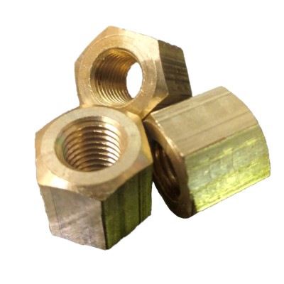 Three 5/16" Brass Ex Nuts Continental are shown. They are hexagonal with threaded interiors, made from brass, and displayed against a white background.