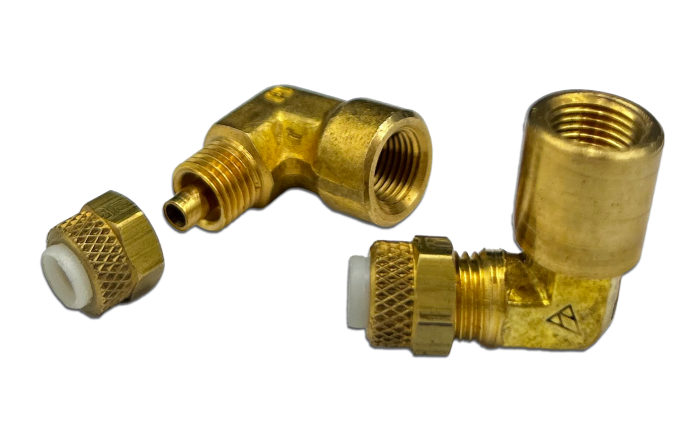 Brass female elbow fittings, including a right-angle connector and a separate nut, shown on a white background. The fittings feature threaded ends for secure connections in plumbing or industrial applications.