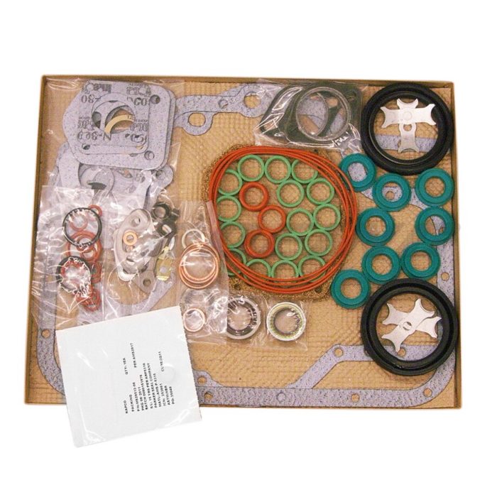 A flat lay image of a mechanical gasket kit, featuring various gaskets, seals, and O-rings in different colors and sizes. The items are arranged on a cardboard base with a list of contents visible in the corner.