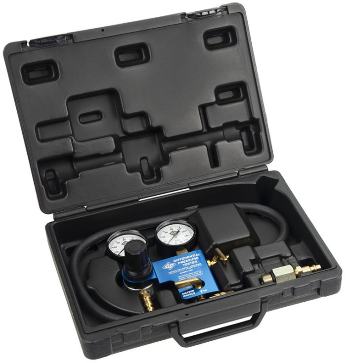 Differential Pressure Kit in a black hard case, open to reveal two pressure gauges, a blue manifold, and various hoses and connectors neatly arranged inside. The kit is designed for measuring differential pressure in various applications.