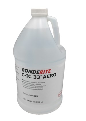 A gallon jug labeled "BONDERITE C-IC 33 AERO," associated with "Alumiprep Brush 33." The jug is white with a handle and contains a clear liquid, used for cleaning and preparing aluminum surfaces.