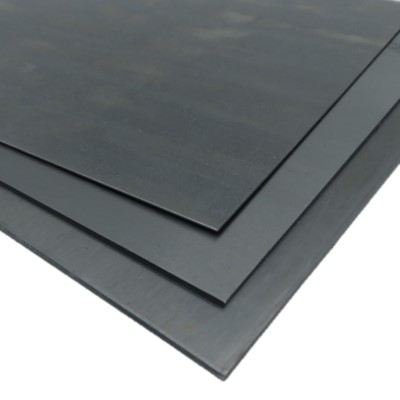 Three stacked sheets of 4130 Chromoly steel, displaying a smooth, dark surface. The sheets are slightly offset, highlighting their thickness and edges.