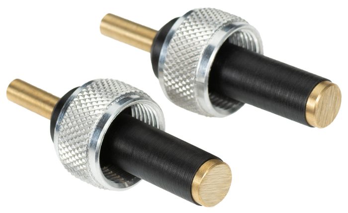 Magneto P-Lead Adapter featuring two cylindrical connectors with a knurled silver grip and black rubber sections. Each connector has a gold-colored metal tip, designed for secure electrical connections in various applications.