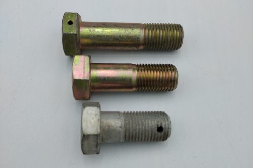 Three metal bolts are arranged horizontally on a plain background. The bolts vary slightly in color and finish. The top two are similar in size and shape, while the bottom one appears shorter. The image relates to "Bolt AN8 – 1/2" (20)".