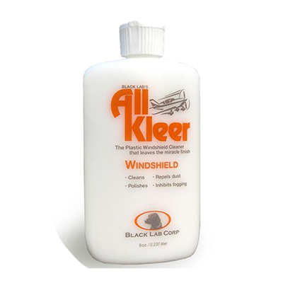 White bottle of All Kleer Plastic Polish, 8oz, with orange text. Label highlights its use for cleaning, repelling dust, polishing, and inhibiting fogging on windshields. Black Lab Corp logo at the bottom.