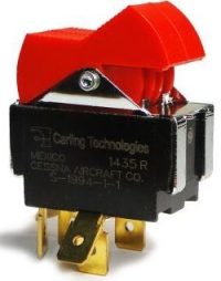 Close-up of a Cessna Split Master Switch & Bracket, featuring a red toggle switch on a black base with gold connectors. The switch is labeled with Carling Technologies and Cessna Aircraft Co. branding.