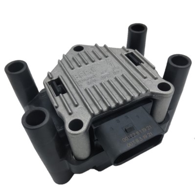 A car ignition coil module with a metallic top and four cylindrical connectors, used for engine ignition systems.