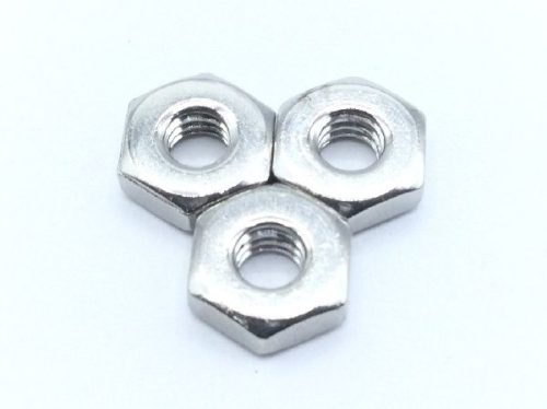 Three shiny electrical stainless hex nuts arranged in a triangular formation on a plain white background.