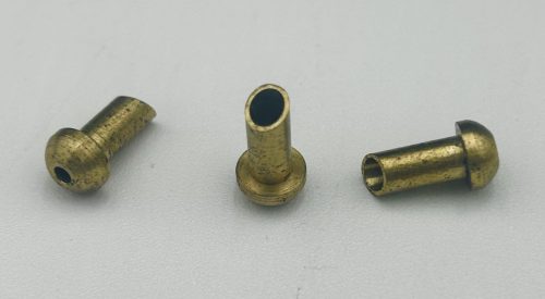 Three brass AN800 Code Union Fittings are displayed on a light gray background. Each fitting has a cylindrical shape with a flared end, showcasing their metallic texture and design.