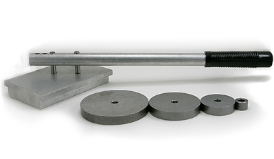 Image of a Jumbo Rod Bender, featuring a long metallic handle attached to a rectangular base. Accompanied by four circular metal dies of varying sizes, used for bending rods. The setup is displayed on a plain white background.