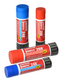 Image of four Loctite Stick Threadlocker containers, two with blue caps labeled 248 and two with red caps labeled 268. They are standing and lying on a white background, showcasing the product's packaging and design.