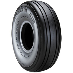 Michelin Aviator Tire displayed upright, showcasing its sleek black rubber design with prominent tread grooves. The sidewall features the text "MICHELIN AIR," indicating its brand and type. The tire is designed for aviation use.