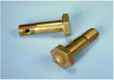 Two Nas Tension Bolts are displayed on a light blue surface. The bolts are gold-colored with hexagonal heads and threaded ends, designed for securing components under tension.