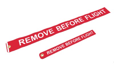 Remove before flight sign on an aircraft, Red remove before flight