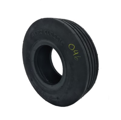 A black Aero Classic Tire with visible tread patterns and the number "040" written in yellow on the side.