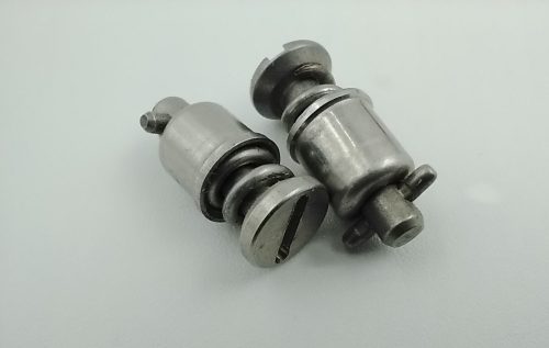 Two stainless steel snap rings are shown on a plain background, featuring a smooth, metallic finish and a cylindrical shape with grooves.