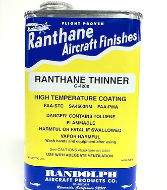 A metal can labeled "Ranthane Aircraft Finishes" contains "Ranthane Thinner G-4200" for high temperature coating. Warnings include flammability, harmful vapor, and to use with adequate ventilation.