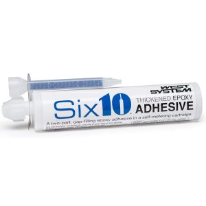 A white tube labeled "Six10 Thickened Epoxy Adhesive" with a mixing nozzle attached. The tube is designed for dispensing a two-part, one-filling epoxy adhesive.