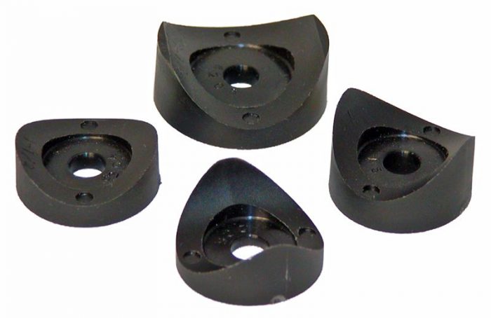 Four black tubing saddles with a triangular shape and central holes, designed for securing or supporting tubing.
