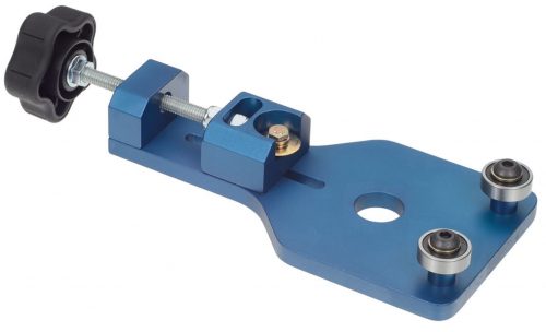 Blue metal oil filter cutter with a black adjustment knob and two small wheels on a flat base. Designed for cutting open oil filters for inspection.