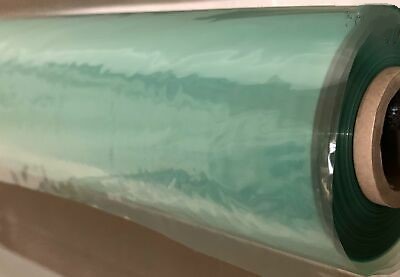 A roll of Stretchlon 200, a translucent green plastic film, partially unrolled and resting on a cardboard core.