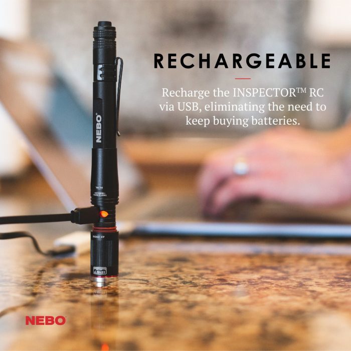A black NEBO INSPECTOR RC flashlight is shown standing upright on a table, connected to a USB cable for charging. Text above reads "Rechargeable" with details about USB charging benefits. A blurred background includes a laptop and a person typing.