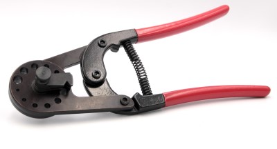 Heavy Duty Rivet Cutter with red handles and a black metal body, featuring a spring mechanism and multiple cutting holes.