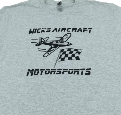 Gray T-shirt featuring a black graphic of an airplane and a checkered flag with the text "Wicks Aircraft Motorsports."