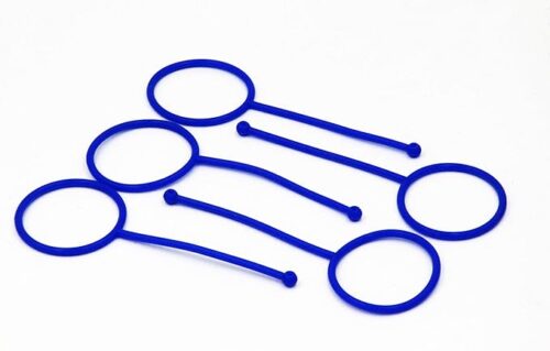 Blue Hold-It Aerosol Straw Holders are shown. They consist of circular loops connected to narrow bands, designed to secure aerosol straws in place.