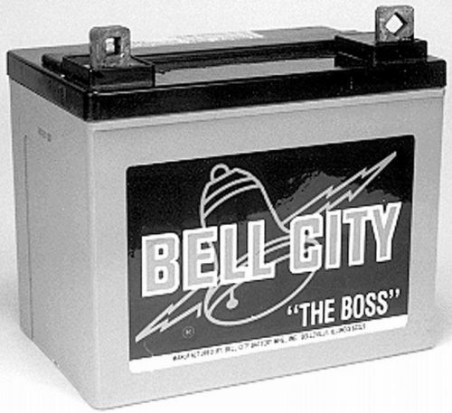 A rectangular battery with a black top and gray body, featuring a label that reads "Bell City 'The Boss'" with an image of a bell and lightning bolt.