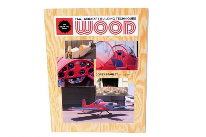 Cover of a book titled "EAA Aircraft Building Techniques: Wood" featuring images of a red aircraft cockpit, dashboard, and a small red plane on a wooden-textured background.