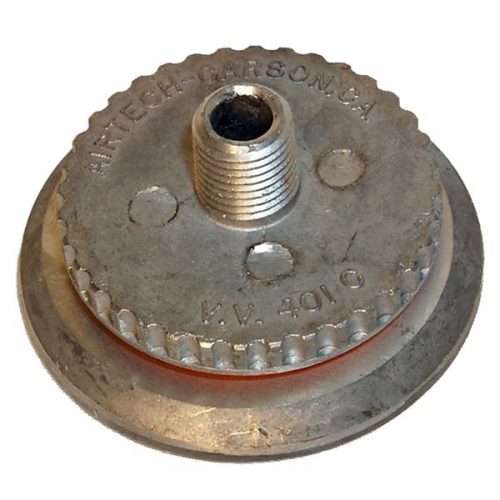 Metallic circular component with a threaded central protrusion and engraved text around the edge. The surface is textured, and the component appears to be part of a mechanical or industrial assembly.