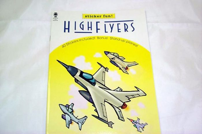 A children's activity book titled "High Flyers" features illustrations of four fighter jets flying against a yellow sky. The book is part of a sticker fun series.