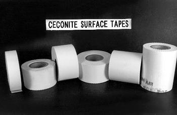 Five rolls of white Ceconite surface tapes of varying sizes are displayed in a row against a dark background. A label above reads "CECONITE SURFACE TAPES."