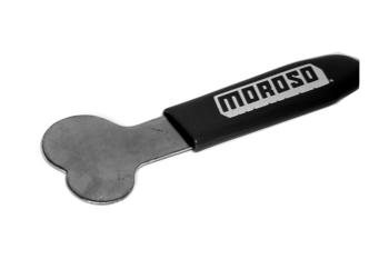 A metal tool with a black handle labeled "Moroso," featuring a flat, rounded end resembling a key or wrench.