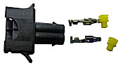 A black electrical connector with two metal terminals and two yellow plastic caps, arranged separately on a white background.