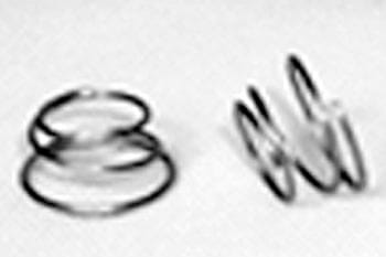 Two metal springs are placed on a surface. The spring on the left is compressed, while the spring on the right is extended. Both are cylindrical and made of thin wire.