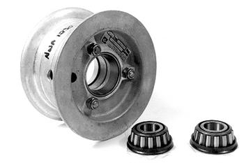A metal wheel hub is displayed with two tapered roller bearings placed in front of it. The hub has visible bolt holes and a central opening. The bearings are positioned side by side on a plain background.