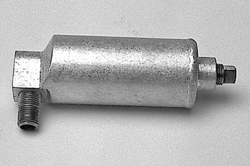 A metallic cylindrical object with threaded ends, lying on a plain surface.