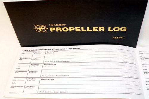 A black book titled "The Standard Propeller Log" with an open page showing columns for recording propeller specifications, repairs, and alterations.