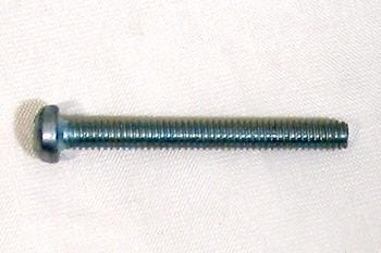 A metal screw with a round head and threaded shaft lies on a light-colored surface.