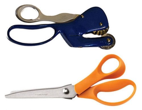 Two pairs of scissors are shown. The top pair has a blue handle and a unique serrated design. The bottom pair features a traditional design with orange handles and silver blades.