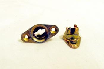 Two small, metallic components on a plain background. One is a circular piece with two side holes, and the other is a conical piece with a notched top. Both have a brass-like finish.