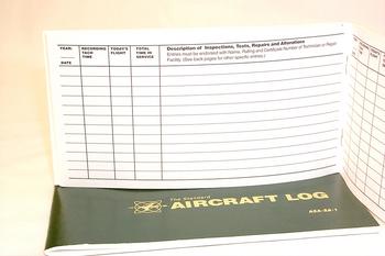 Open aircraft logbook showing columns for date, flight number, pilot's name, and remarks. The cover is green with gold text reading "Aircraft Log."