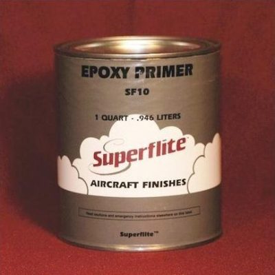 A can of Superflite Epoxy Primer SF10, labeled for aircraft finishes, containing 1 quart (0.946 liters). The can features a cloud design on a red background.